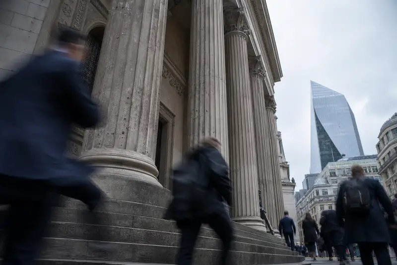 Stone columns of a financial building in the City of London on a grey morning